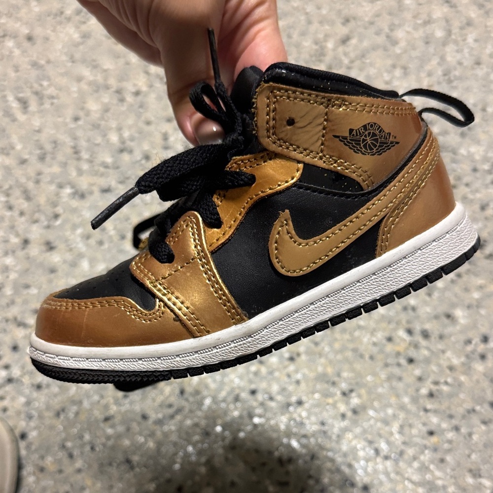 Nike Jordan Black and gold Sneakers